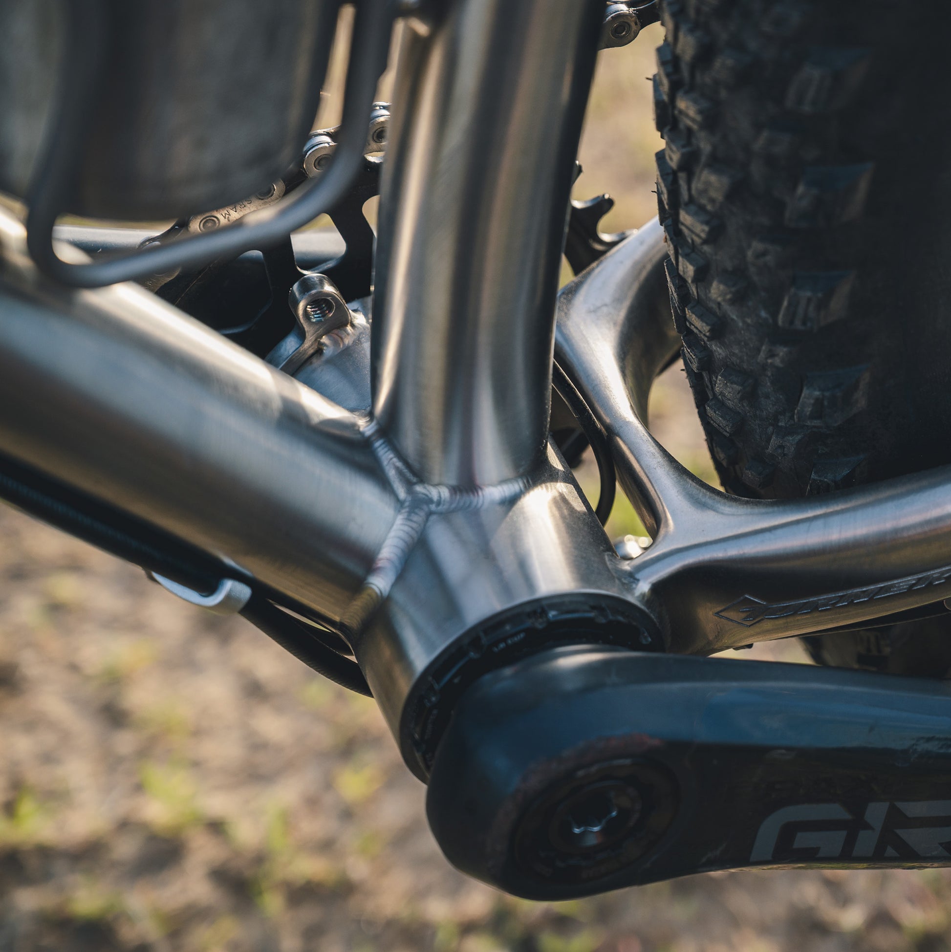 Close-up of a titanium mountain bike frame custom bottom bracket